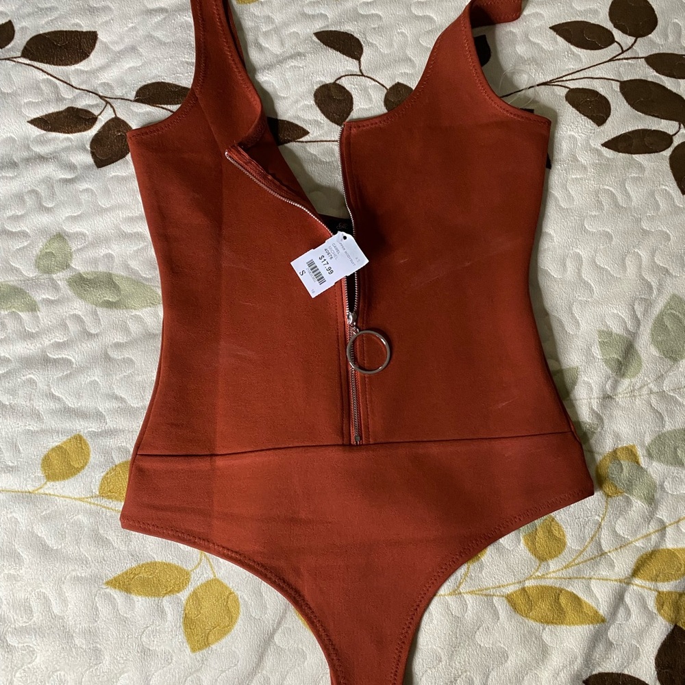 Brand new bodysuit. Tag still on, got the wrong size.
